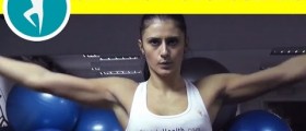 Workout for shoulders with weights: standing side lateral raise with dumbbells